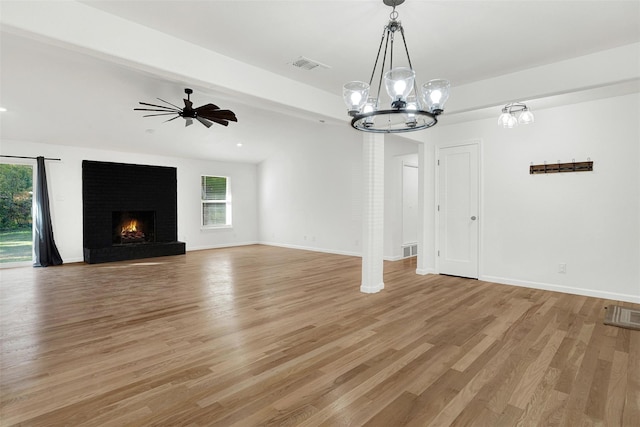 413 Shadowwood Trl, Ovilla, TX 75154 - unfurnished living room with healthy amount of natural light, light wood-style floors, and a brick fireplace