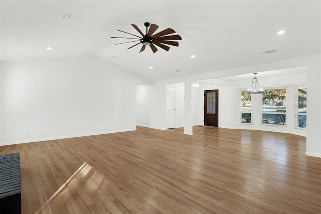 413 Shadowwood Trl, Ovilla, TX 75154 - unfurnished living room featuring a chandelier, light wood finished floors, lofted ceiling, ceiling fan, and baseboards