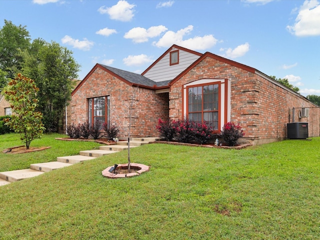 1640 Lemonwood Cir, Mesquite, TX 75149 - view of front facade featuring brick siding, central AC unit, and a front lawn