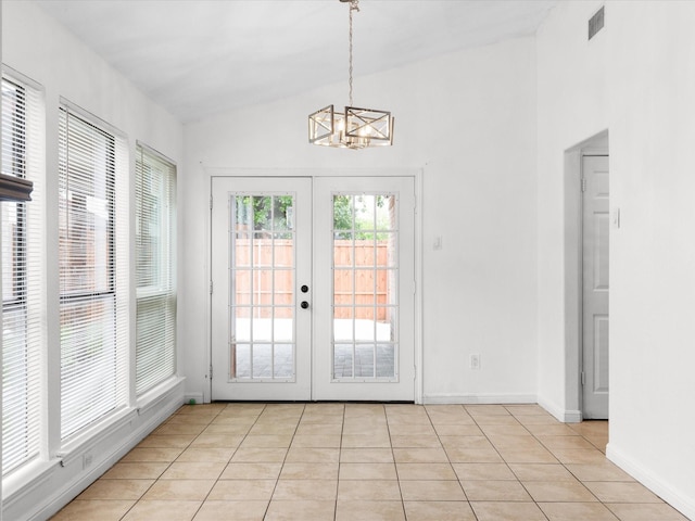 1640 Lemonwood Cir, Mesquite, TX 75149 - entryway with a chandelier, lofted ceiling, french doors, light tile patterned floors, and baseboards