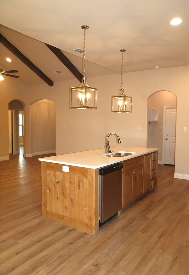 701 Raylan St, Springtown, TX 76082 - kitchen featuring stainless steel dishwasher, arched walkways, light wood-style floors, an island with sink, and recessed lighting