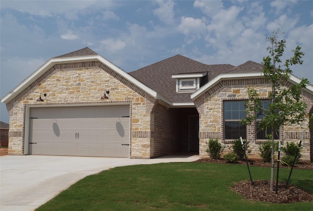 701 Raylan St, Springtown, TX 76082 - french country home featuring stone siding, an attached garage, driveway, roof with shingles, and a front yard
