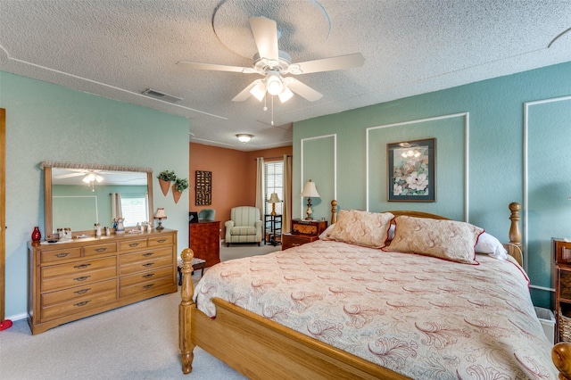 1001 Woodhaven Ct, Euless, TX 76039 - carpeted bedroom with a textured ceiling and a ceiling fan