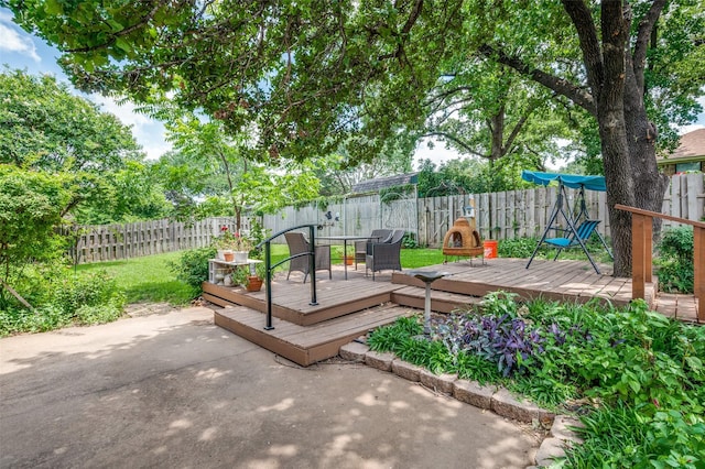 1001 Woodhaven Ct, Euless, TX 76039 - wooden deck featuring a patio and a fenced backyard