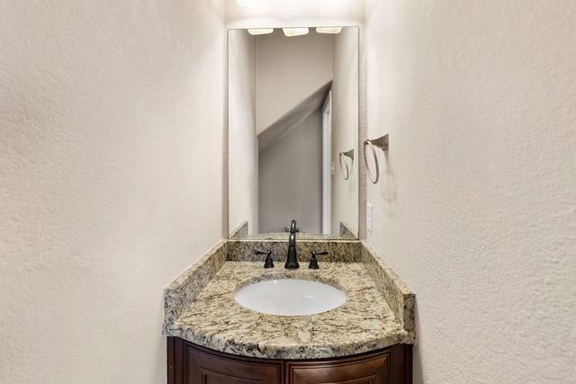 7603 Cousteau Dr, Rowlett, TX 75088 - bathroom featuring a textured wall and vanity