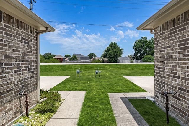 7603 Cousteau Dr, Rowlett, TX 75088 - view of grassy yard featuring a patio
