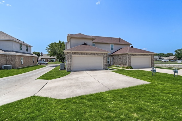 7603 Cousteau Dr, Rowlett, TX 75088 - view of front of house with brick siding, a front yard, and cooling unit