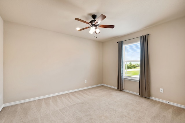7603 Cousteau Dr, Rowlett, TX 75088 - spare room with light carpet, baseboards, and a ceiling fan