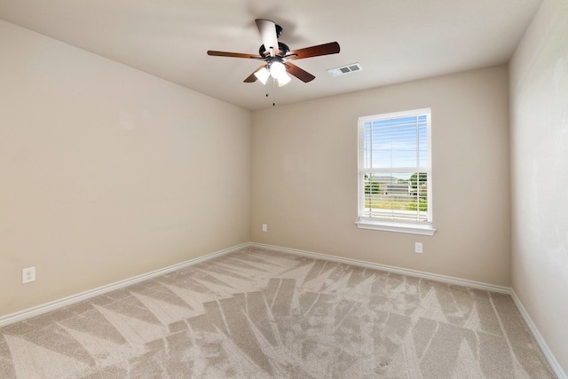 7603 Cousteau Dr, Rowlett, TX 75088 - spare room with light colored carpet, a ceiling fan, and baseboards