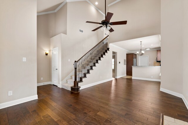 7603 Cousteau Dr, Rowlett, TX 75088 - unfurnished living room featuring a chandelier, high vaulted ceiling, ceiling fan, dark wood-type flooring, and baseboards