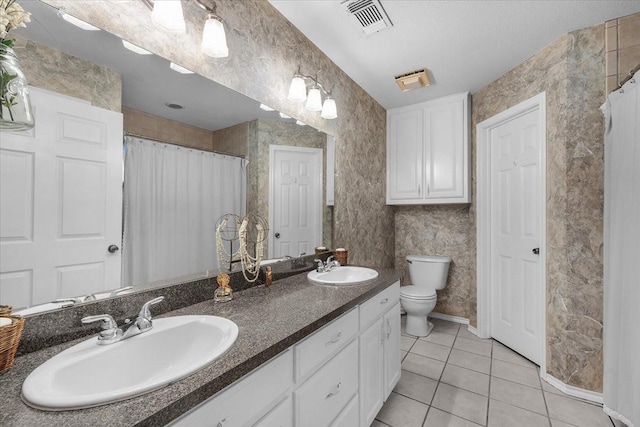5212 Cross Timber Rd W, Cleburne, TX 76031 - full bath with tile patterned floors, double vanity, and a shower with curtain