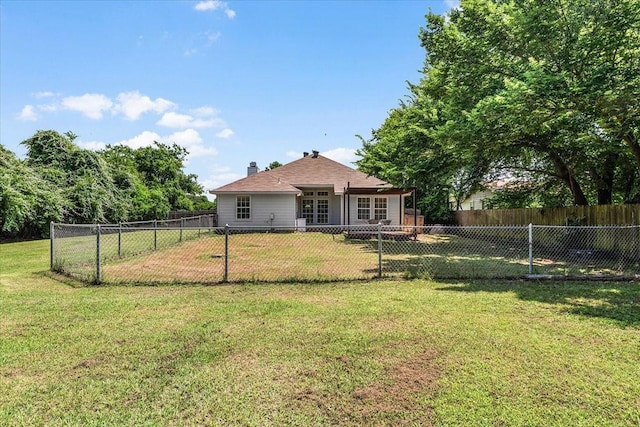 5212 Cross Timber Rd W, Cleburne, TX 76031 - back of house with a fenced backyard and a chimney
