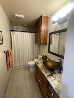 2510 Plumdale Dr, Carrollton, TX 75006 - full bathroom featuring vanity and toilet