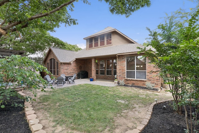 107 Barkley Dr, Hickory Creek, TX 75065 - back of property with brick siding, a patio area, roof with shingles, and a yard