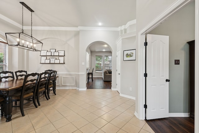107 Barkley Dr, Hickory Creek, TX 75065 - dining space featuring arched walkways, crown molding, light tile patterned floors, recessed lighting, and a chandelier