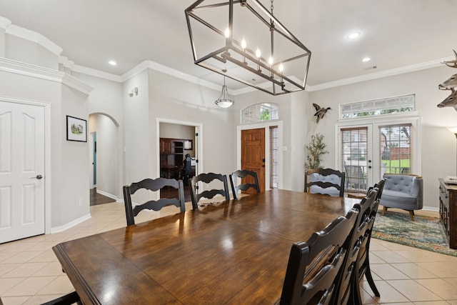 107 Barkley Dr, Hickory Creek, TX 75065 - dining area with light tile patterned flooring, arched walkways, recessed lighting, ornamental molding, and french doors