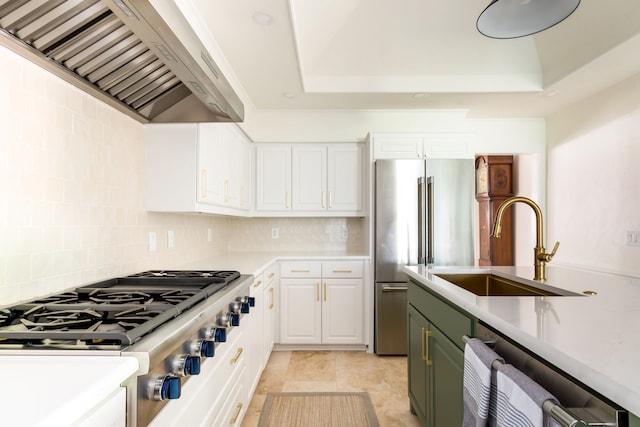2020 Winding Hollow Ln, Plano, TX 75093 - kitchen featuring wall chimney exhaust hood, stainless steel appliances, a sink, light countertops, and backsplash