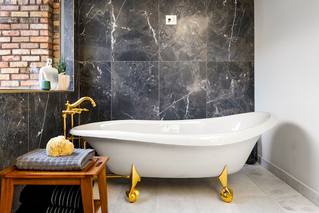 2020 Winding Hollow Ln, Plano, TX 75093 - bathroom with a freestanding tub, tile walls, and baseboards