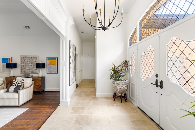 2020 Winding Hollow Ln, Plano, TX 75093 - foyer with baseboards, a chandelier, and a towering ceiling