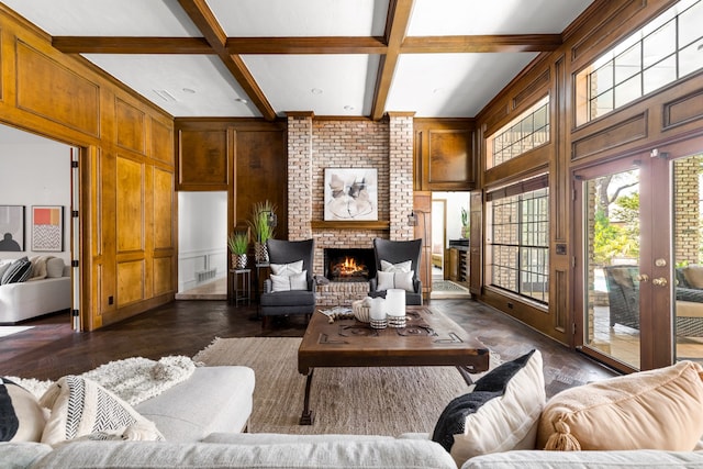 2020 Winding Hollow Ln, Plano, TX 75093 - living area with dark wood-style flooring, a decorative wall, coffered ceiling, beam ceiling, and a fireplace