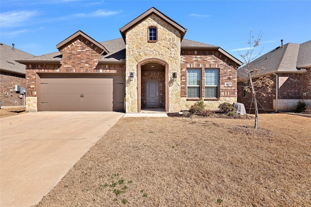 10407 Twisting Springs Dr, Aubrey, TX 76227 - french country inspired facade featuring brick siding, roof with shingles, an attached garage, driveway, and stone siding