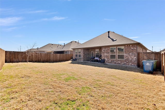 10407 Twisting Springs Dr, Aubrey, TX 76227 - rear view of property featuring brick siding and roof with shingles