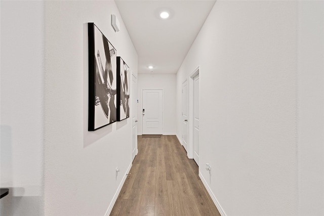 10407 Twisting Springs Dr, Aubrey, TX 76227 - hallway featuring wood finished floors, recessed lighting, and baseboards
