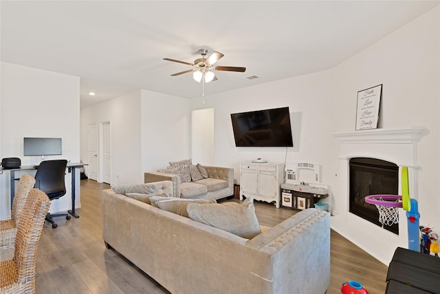 10407 Twisting Springs Dr, Aubrey, TX 76227 - living room with a ceiling fan, wood finished floors, a glass covered fireplace, and recessed lighting
