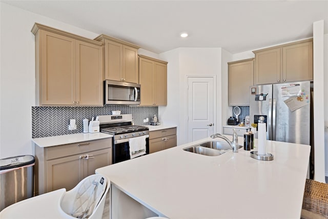10407 Twisting Springs Dr, Aubrey, TX 76227 - kitchen with stainless steel appliances, a sink, light countertops, decorative backsplash, and a center island with sink