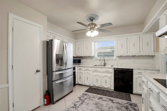 9718 Burney Dr, Dallas, TX 75243 - kitchen with stainless steel appliances, a sink, white cabinetry, a ceiling fan, and light tile patterned flooring