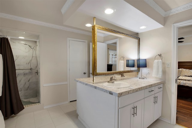9718 Burney Dr, Dallas, TX 75243 - ensuite bathroom featuring double vanity, crown molding, a tile shower, baseboards, and recessed lighting