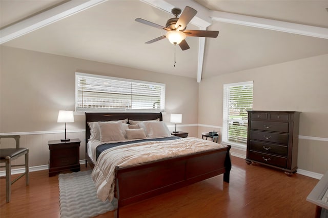 9718 Burney Dr, Dallas, TX 75243 - bedroom with wood finished floors, a wainscoted wall, and ceiling fan