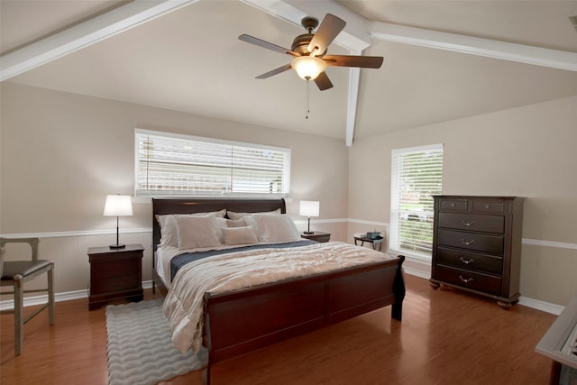9718 Burney Dr, Dallas, TX 75243 - bedroom with wainscoting, wood finished floors, and a ceiling fan
