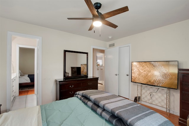 9718 Burney Dr, Dallas, TX 75243 - bedroom featuring ceiling fan and wood finished floors