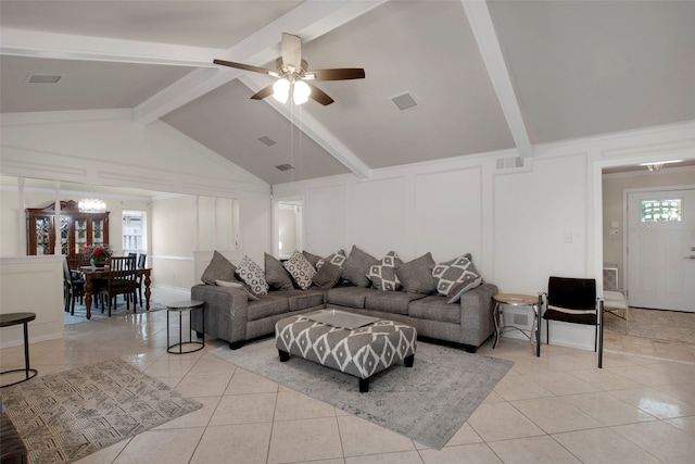 9718 Burney Dr, Dallas, TX 75243 - living area featuring a decorative wall, light tile patterned flooring, a chandelier, and a ceiling fan