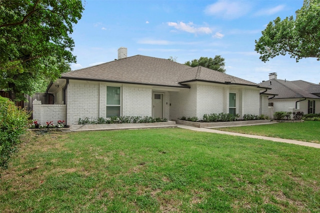 9718 Burney Dr, Dallas, TX 75243 - view of front facade featuring a chimney and brick siding