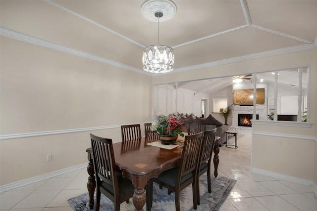 9718 Burney Dr, Dallas, TX 75243 - dining area featuring vaulted ceiling, light tile patterned floors, a warm lit fireplace, and baseboards