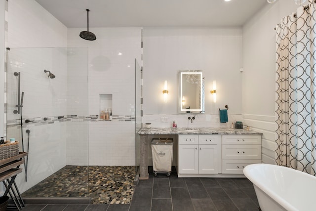 1234 Shelby Ln, Celina, TX 75009 - full bathroom featuring vanity, a walk in shower, a freestanding bath, tile patterned flooring, and wainscoting