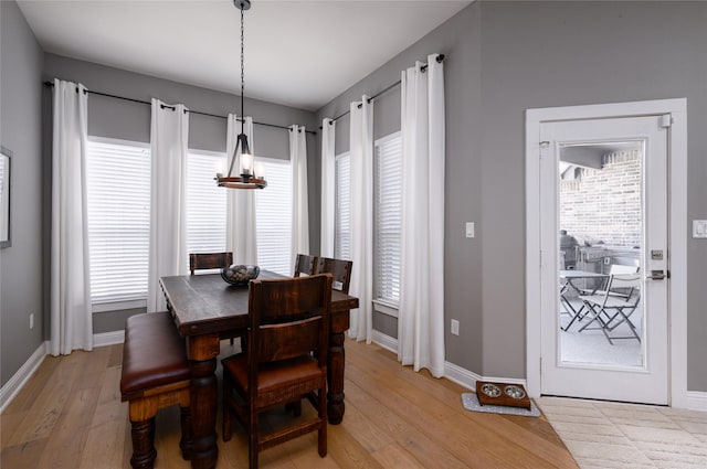 2113 Twin Creeks Cir, Pilot Point, TX 76258 - dining room with light wood finished floors, baseboards, and a chandelier