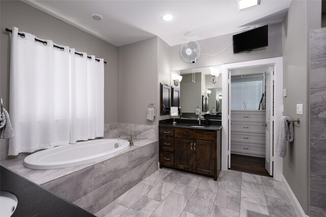2113 Twin Creeks Cir, Pilot Point, TX 76258 - bathroom featuring vanity, a bath, marble finish flooring, and recessed lighting