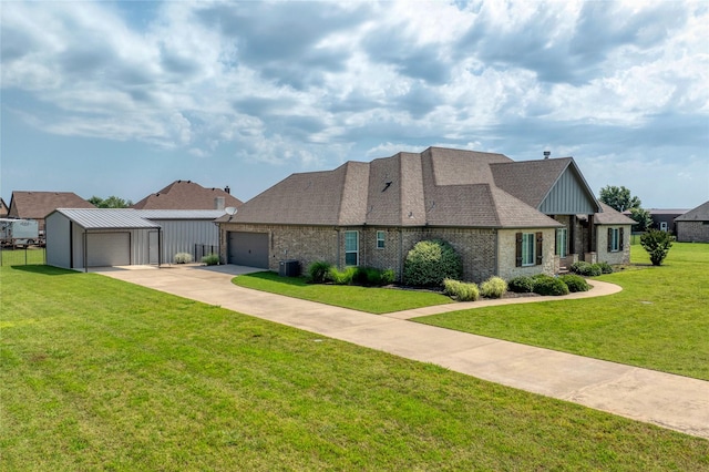 2113 Twin Creeks Cir, Pilot Point, TX 76258 - view of front of property featuring central air condition unit, a front yard, concrete driveway, board and batten siding, and brick siding