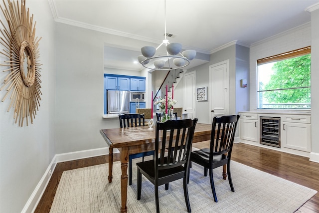 5152 Vickery Blvd, Dallas, TX 75206 - dining room with wine cooler, dark wood finished floors, a chandelier, baseboards, and ornamental molding