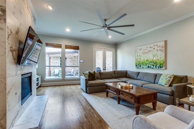 5152 Vickery Blvd, Dallas, TX 75206 - living room featuring wood finished floors, ceiling fan, healthy amount of natural light, a premium fireplace, and recessed lighting