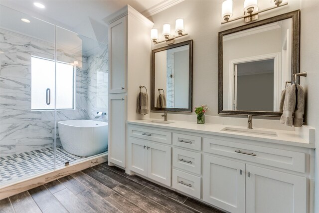 5152 Vickery Blvd, Dallas, TX 75206 - full bathroom featuring double vanity, a freestanding tub, crown molding, a marble finish shower, and recessed lighting