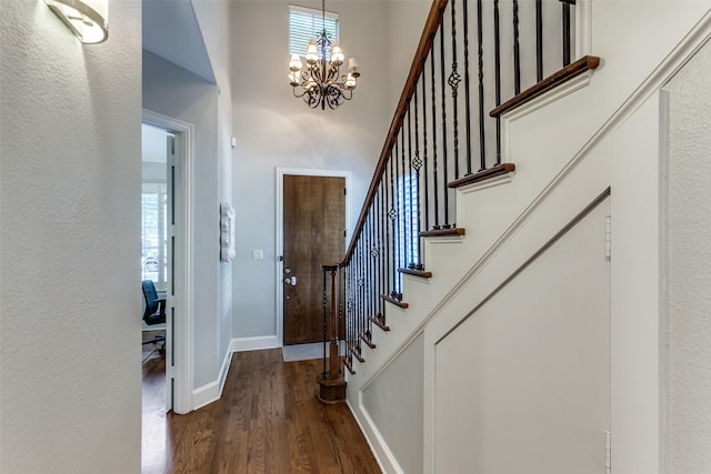 5152 Vickery Blvd, Dallas, TX 75206 - entryway featuring a chandelier, dark wood-style flooring, stairs, baseboards, and a towering ceiling