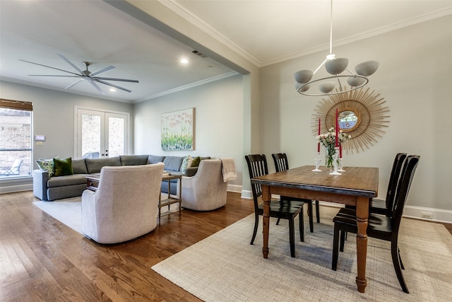 5152 Vickery Blvd, Dallas, TX 75206 - dining room with a chandelier, a ceiling fan, wood finished floors, baseboards, and ornamental molding