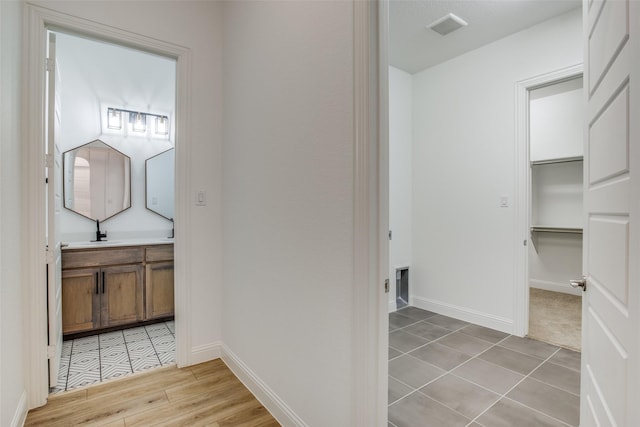 8235 Ottowa Rdg, Frisco, TX 75034 - bathroom with vanity, baseboards, and tile patterned floors