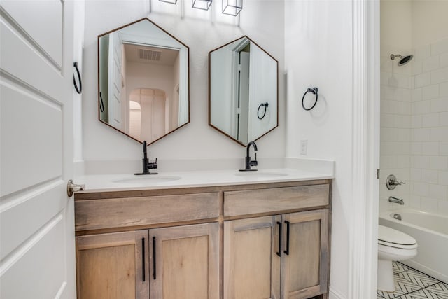 8235 Ottowa Rdg, Frisco, TX 75034 - full bathroom featuring double vanity, toilet, bathing tub / shower combination, and tile patterned floors