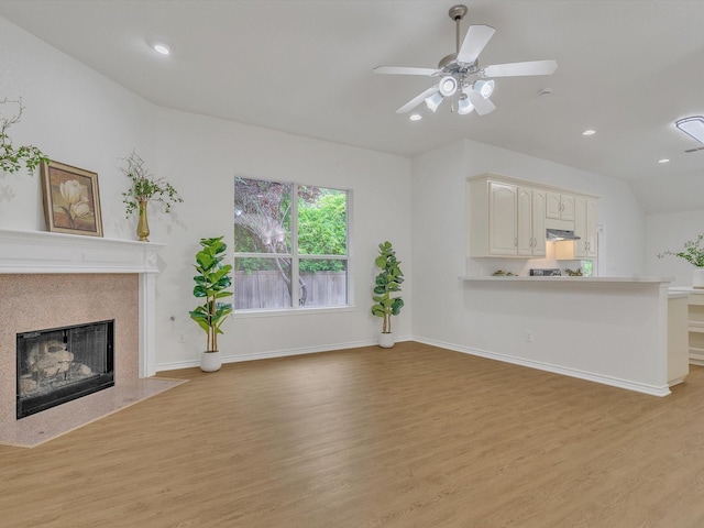 1536 Valley Creek Rd, Denton, TX 76205 - unfurnished living room with light wood finished floors, a premium fireplace, ceiling fan, and recessed lighting