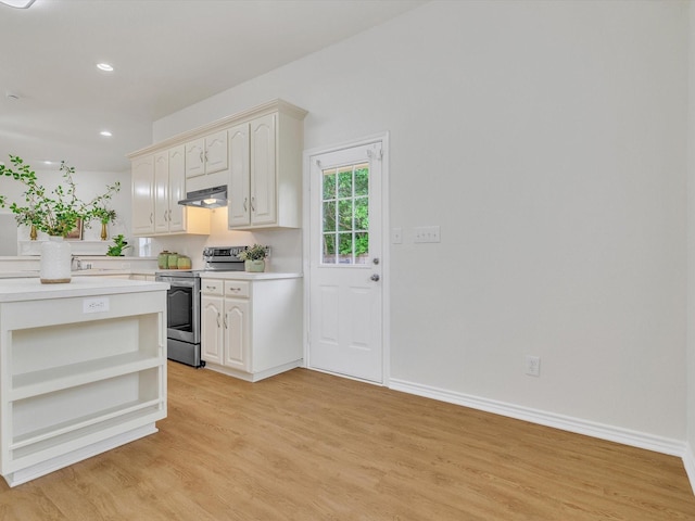 1536 Valley Creek Rd, Denton, TX 76205 - kitchen with stainless steel range with electric stovetop, open shelves, under cabinet range hood, light countertops, and light wood finished floors